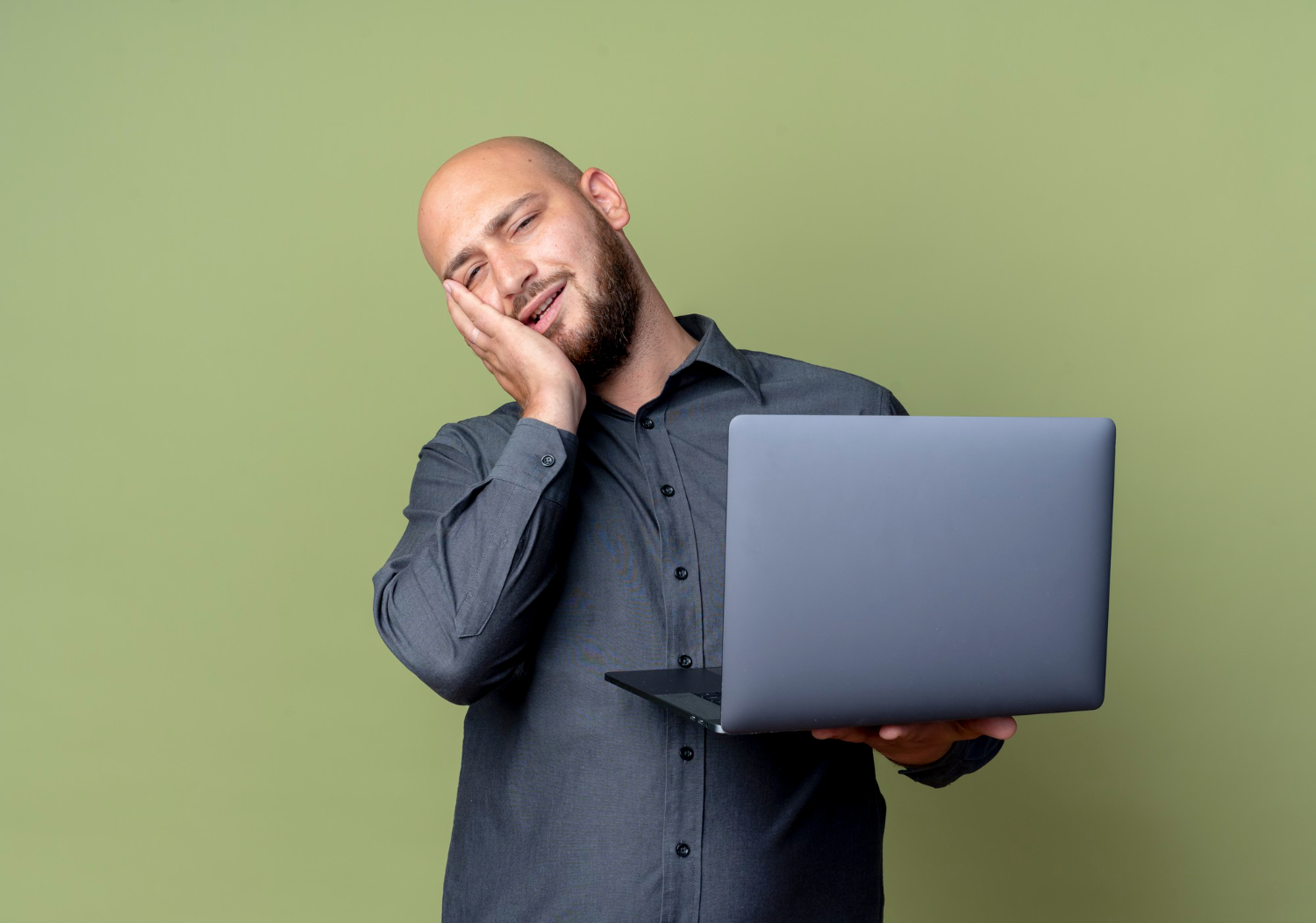 a man with a laptop in his hand